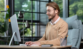 a-young-male-programmer-freelancer-sits-in-the-of-2023-02-11-05-25-15-utc