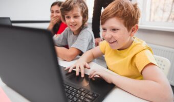 company-of-children-using-laptops-during-programmi-2022-11-12-14-54-13-utc