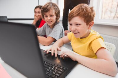 company-of-children-using-laptops-during-programmi-2022-11-12-14-54-13-utc