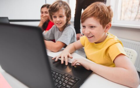 company-of-children-using-laptops-during-programmi-2022-11-12-14-54-13-utc